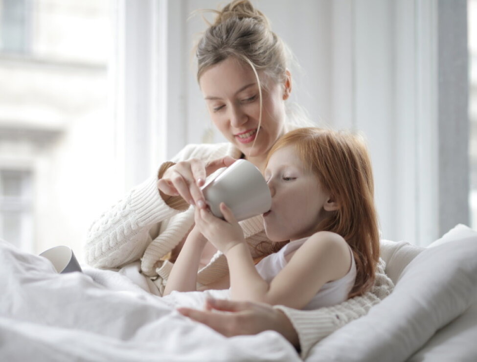 What is the function of adenoids and tonsils in children, and under what conditions is surgical...